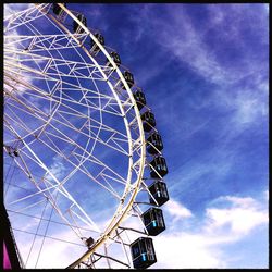 Low angle view of ferris wheel against sky