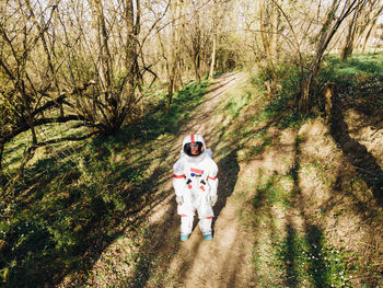 Portrait of man standing in forest