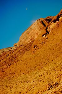Low angle view of rock formations against sky