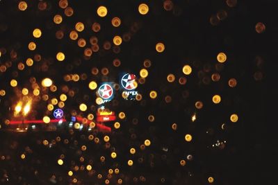 Defocused image of illuminated lights at night