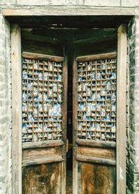 Open old wooden door of house