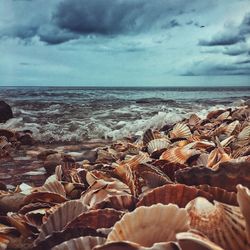 Scenic view of sea against cloudy sky