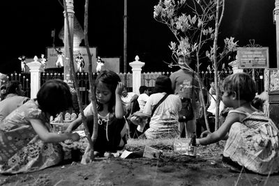 People on sidewalk in city