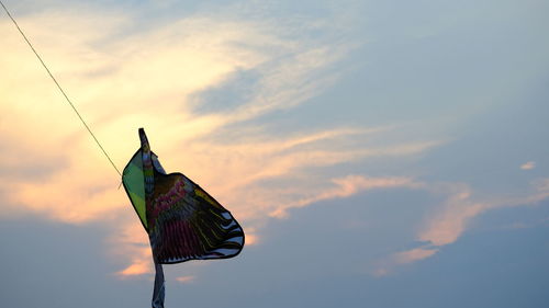 Low angle view of bird flying against sky