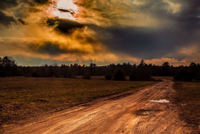 Scenic view of field against sky during sunset