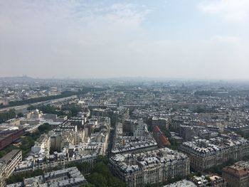 High angle view of city buildings against sky