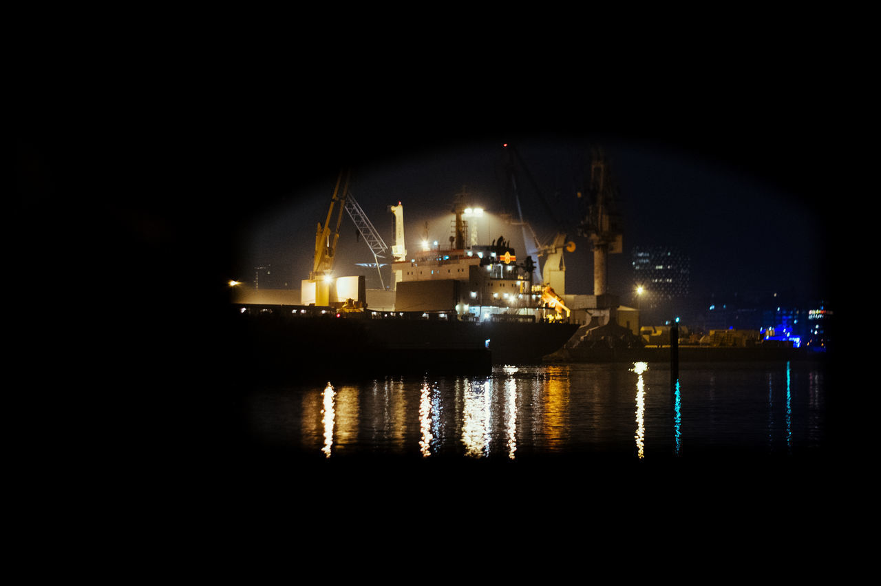 ILLUMINATED COMMERCIAL DOCK AT NIGHT