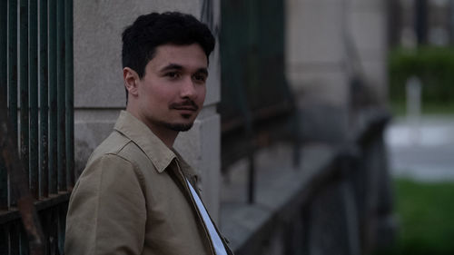 Portrait of young man standing outdoors