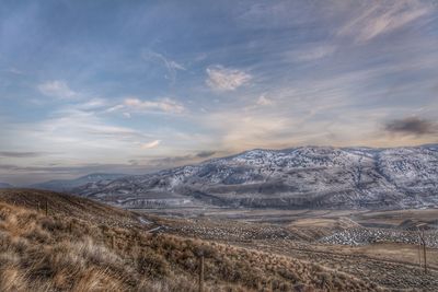 Scenic view of snowcapped mountains against sky