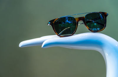 Close-up of sunglasses on statue