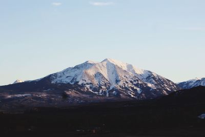 Scenic view of snowcapped mountains against sky