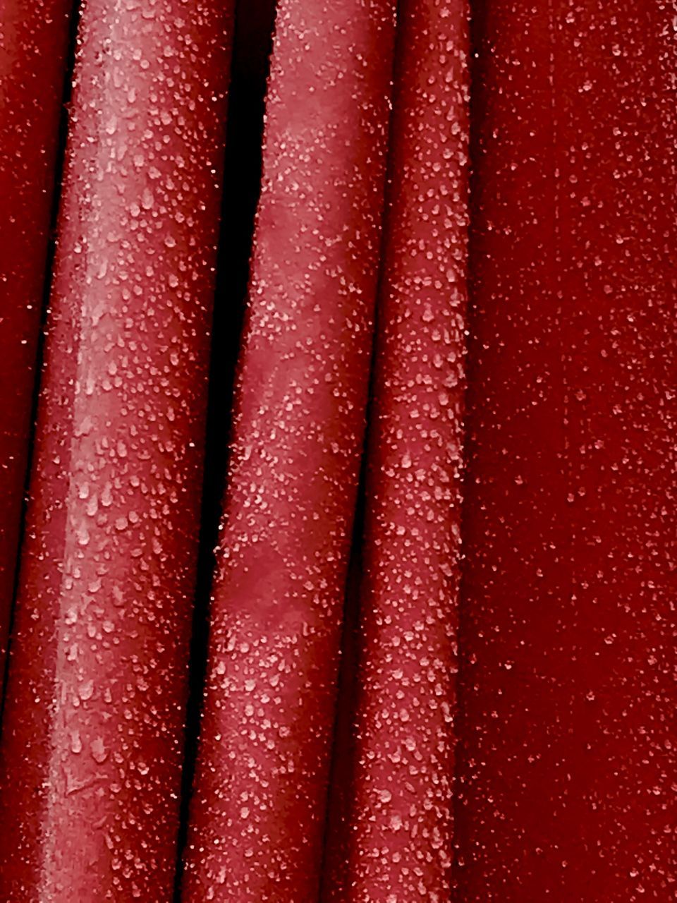 FULL FRAME SHOT OF WATER DROPS ON GLASS