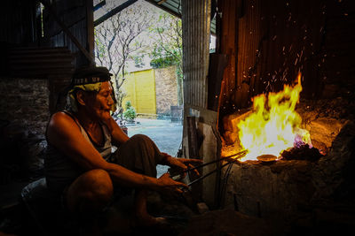 Man sitting on wood