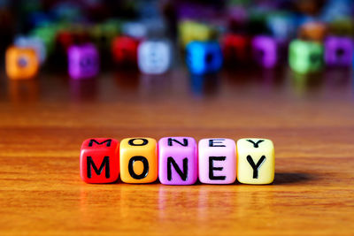 Close-up of text on multi colored toy blocks table