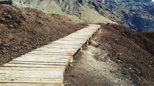 Footpath on field leading towards mountains