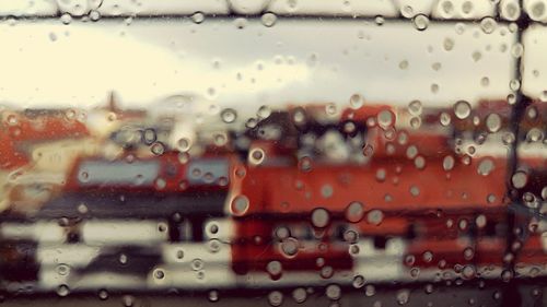 Full frame shot of wet glass window in rainy season