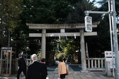 People in front of built structure