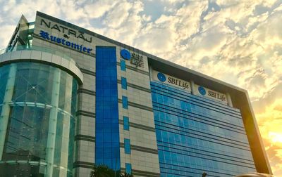 Low angle view of text on building against sky