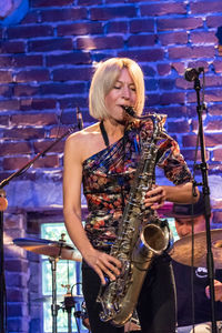 Woman playing saxophone during concert