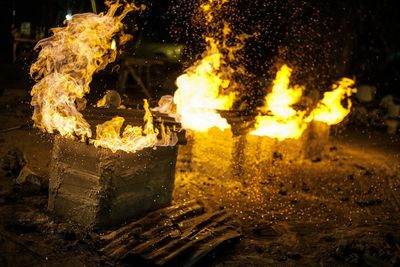 Close-up of burning fire at night