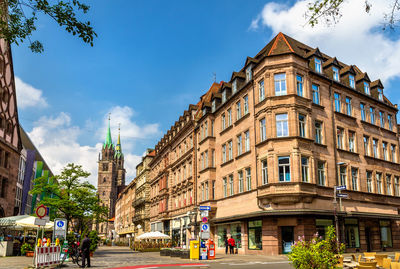 Panoramic view of buildings and city street against sky