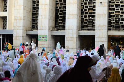 Indonesian women get ready for the eid al fitr prayer at istiqlal mosque in jakarta 