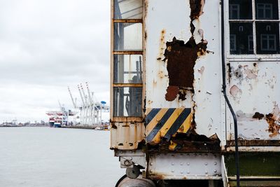 Boats in river with buildings in background