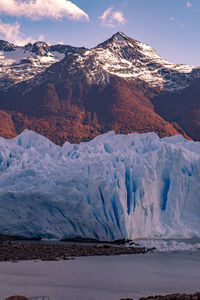 Scenic view of glacier mountains against sky