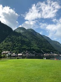 Scenic view of field and mountains against sky