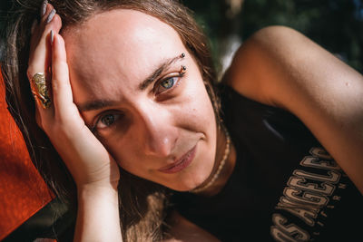 Close-up of young woman looking at the camera 