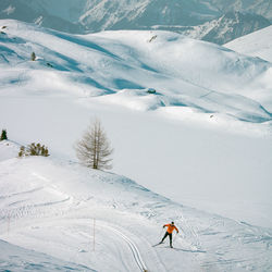 Person skiing on snowcapped mountain