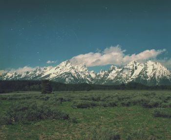Scenic view of snowcapped mountains against sky