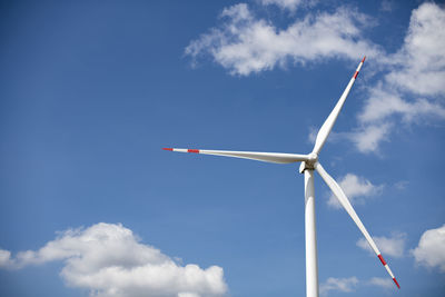 Low angle view of wind turbine against sky