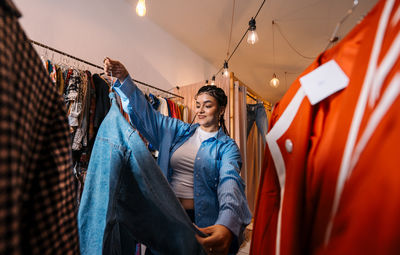 Rear view of woman standing in store