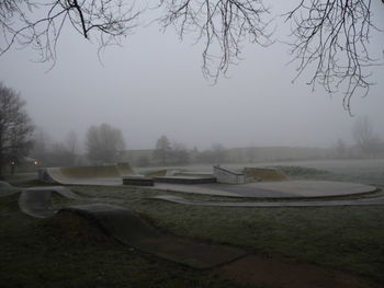 Scenic view of lake against sky during foggy weather