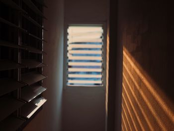 View of sunlight coming through window on wall