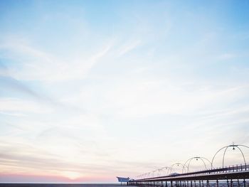 View of pier against cloudy sky