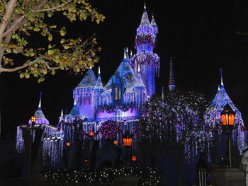 Low angle view of illuminated buildings at night