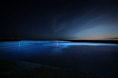 Scenic view of sea against sky at night