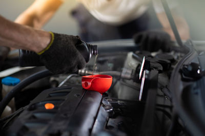 Close-up of man working on car