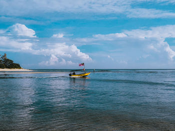 Seascape scenery with a small boat in terengganu, malaysia.
