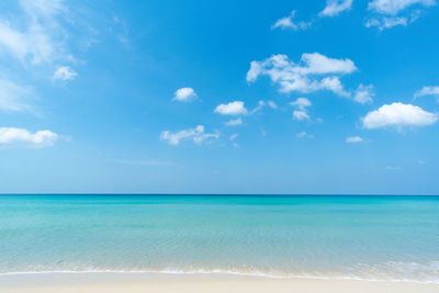 Scenic view of sea against blue sky