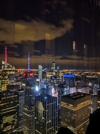 Illuminated buildings in city at night