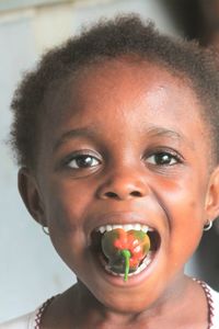 Close-up portrait of boy eating food