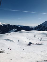 Scenic view of snow covered mountains against sky