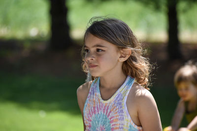 Portrait of young woman standing outdoors