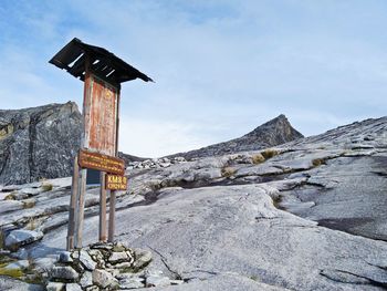 Lifeguard hut on mountain against sky