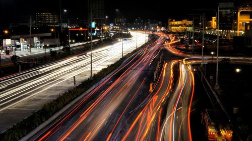 High angle view of light trails on road at night