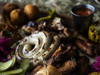 High angle view of roasted meat on barbecue