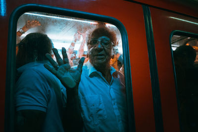 Friends seen through train window